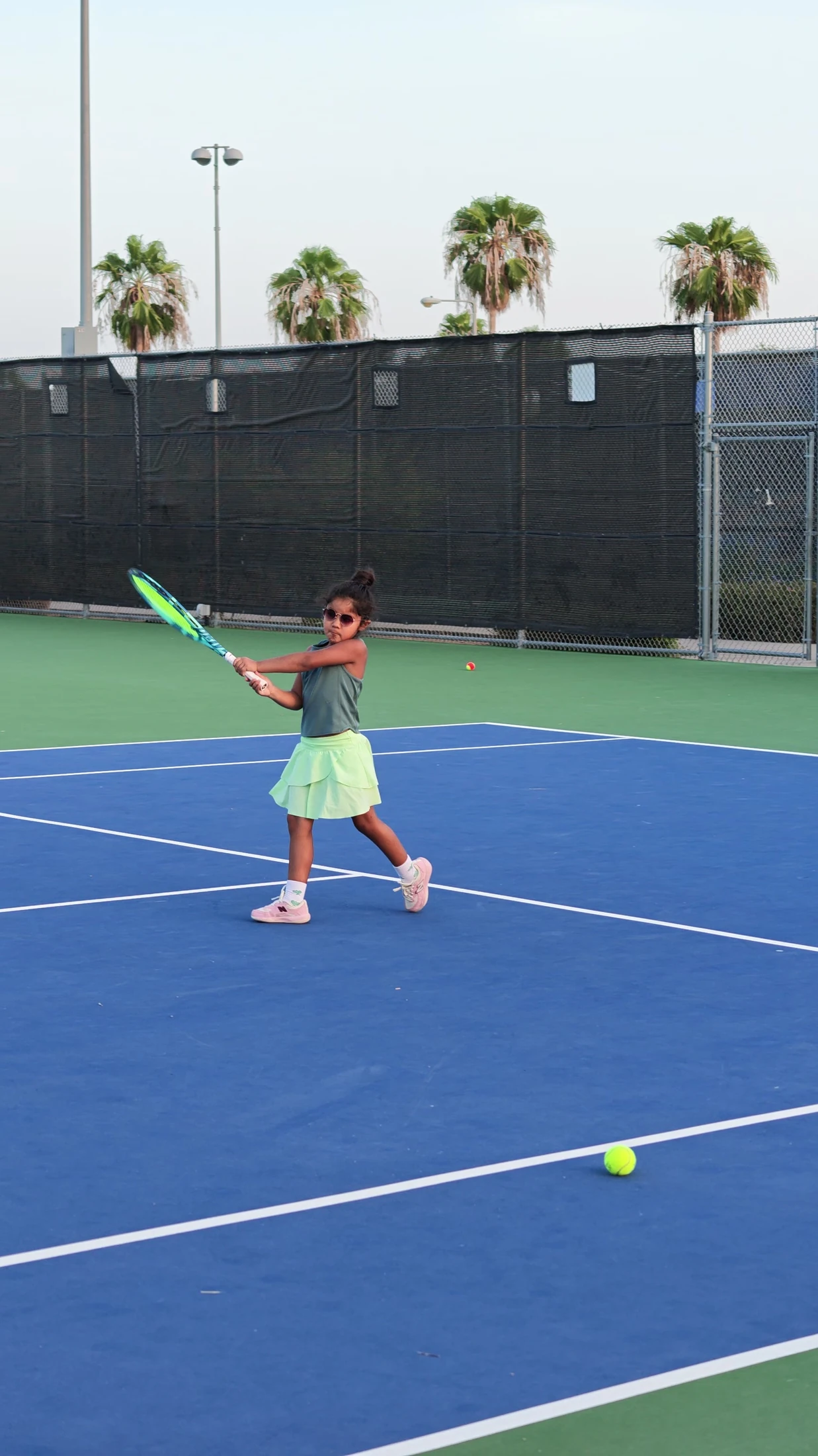 Penny training on a tennis court
